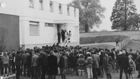 Students gathered to protest outside the university vice-chancellor's house.