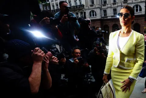 Hannah McKay / Reuters Rebekah Vardy, wife of Leicester City football player Jamie Vardy, arrives at the Royal Courts of Justice, in London, 16 May 2022