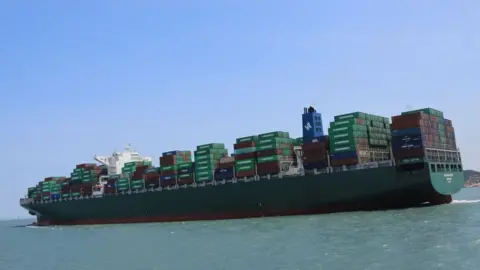 VCG / Getty Images container ship at sea