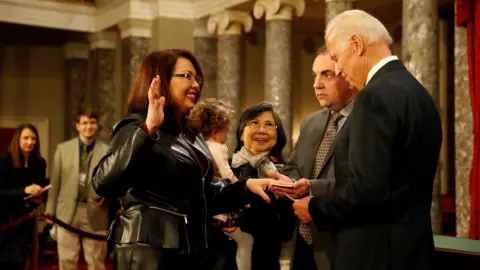 Getty Images U.S. Sen. Tammy Duckworth (D-IL) participates in a reenacted swearing-in with U.S. Vice President Joe Biden