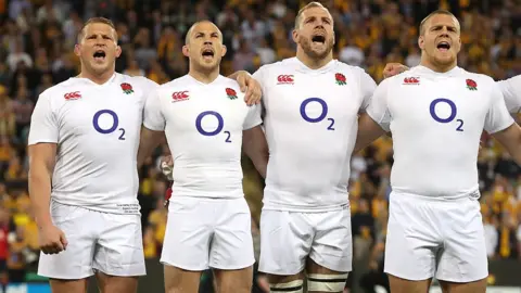 Getty Images England rugby players lining up to sing anthem