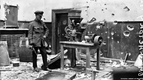 National Library of Ireland A soldier surveys the damage to the PRO in 1922