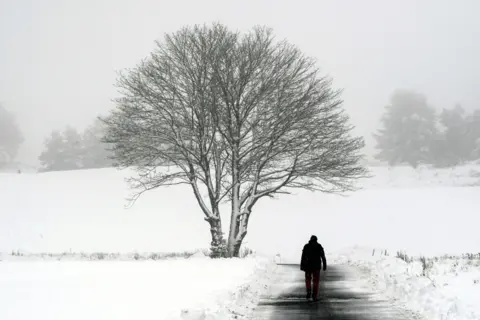 AFP A man walks along a path at Gleneagles golf course in Scotland on 14 January 2021