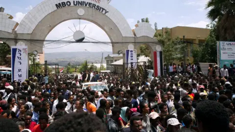 Getty Images People fill the road after the rally of Ethiopia's new Prime Minister in Ambo, about 120km west of Addis Ababa, Ethiopia, on April 11, 2018