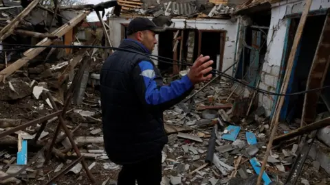 Reuters Home damaged in a missile strike near the Russian border in Kharkiv region, 21 October