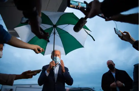 Roberto Schmidt / Getty Images Joe Biden speaks to the press