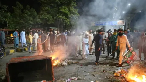 Getty Images Imran Khan supporters protesting against Mr Khan's shock arrest