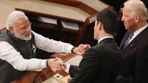 AFP Indian Prime Minister Narendra Modi, (L), shakes hands with House Speaker Paul Ryan (R-WI), (C), and US Vice President Joseph Biden (