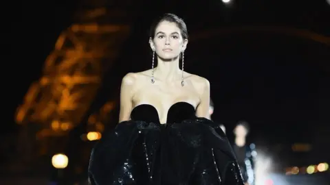 Getty Images Kaia Gerber walks the runway during the Saint Laurent show