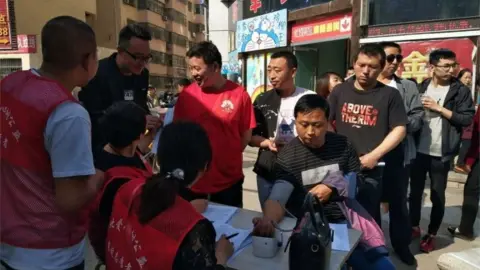 EPA Locals give blood in Yulin city in China where nine schoolchildren were stabbed to death, 28 April 2018