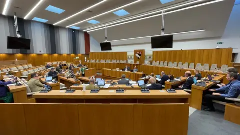 Shaun Whitmore/BBC Councillors in council chamber at Norfolk County Council