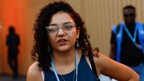 Reuters Sanaa Seif, the sister of Alaa Abdel Fattah, speaks to reporters in Sharm el-Sheikh, Egypt (7 November 2022)