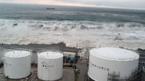 Getty Images Waves breaching the sea wall of the Fukushima power plant, March 2011