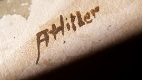 AFP A watercolour signature says ' A Hitler'