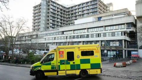 Getty Images A file image showing the entrance to the Royal Free Hospital in Camden, a multi-storey concrete building, with a yellow and green ambulance turning in front of it