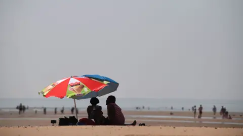 AFP People on a beach