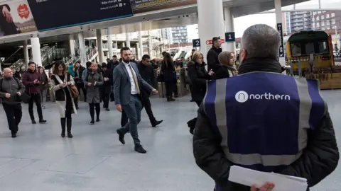 Getty Images commuters at rail station