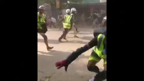 Protesters in Mandalay fleeing security forces on 13 March 2021