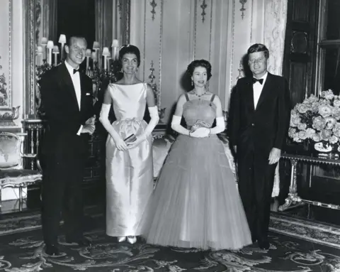 Getty Images At Buckingham Palace during a banquet held in his honour, President John F Kennedy and his wife, First Lady Jacqueline Kennedy, pose with Queen Elizabeth II and her husband, Prince Philip, Duke of Edinburgh, London, United Kingdom, June 15, 1961.