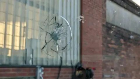 Manchester City The windscreen of Manchester City's team coach