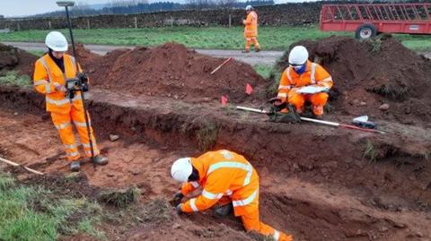 Archeologists working at the A66