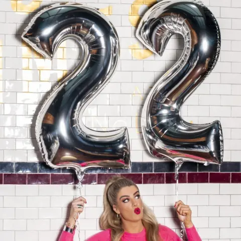 RTÉ 2019/Lili Forberg Sarah McTernan holding ballons that read out 22 - the name of her song