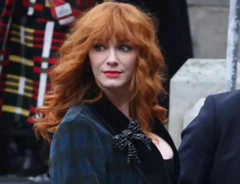 Getty Images Christina Hendricks arrives for a memorial service to honour and celebrate the life of fashion designer Dame Vivienne Westwood at Southwark Cathedral, London,