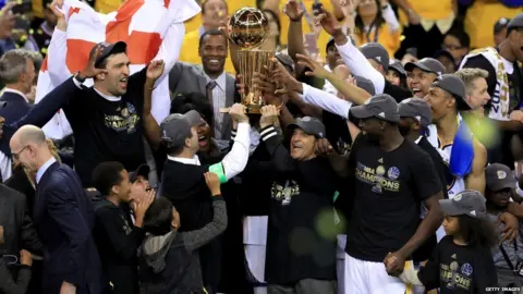 Getty Images Golden State Warriors lift NBA Trophy
