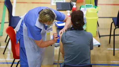 Getty Images Vaccine being administered at a centre in Cwmbran