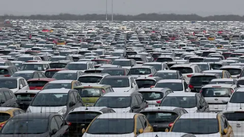 Getty Images Hundreds of new cars parked up for import and export at Grimsby Docks