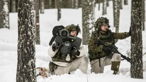 Getty Images Members of the Estonian army during military training together with UK soldiers