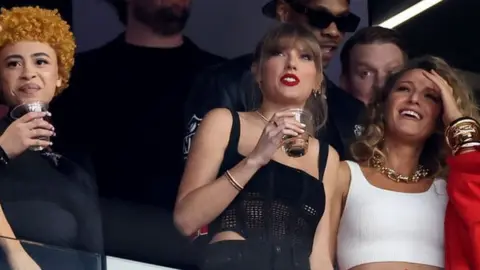 Getty Images Singer Taylor Swift and Actress Blake Lively react before Super Bowl LVIII between the San Francisco 49ers and Kansas City Chiefs at Allegiant Stadium on February 11, 2024 in Las Vegas, Nevada