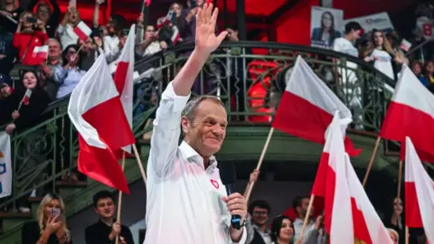 Getty Images Donald Tusk addresses a crowd ahead of Poland's election in October 2023