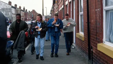 Getty Images Fans on their way to a Manchester City match