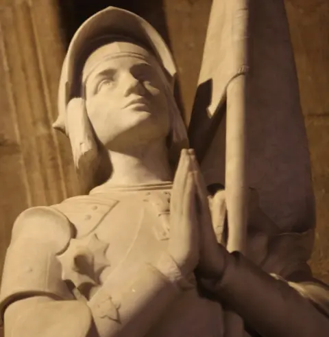 Getty Images A statue of St Joan of Arc inside Notre-Dame