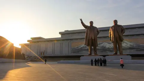 Jean H. Lee/Getty images North Koreans pay their respects at the bronze statues of late North Korean leaders Kim Il Sung and Kim Jong Il