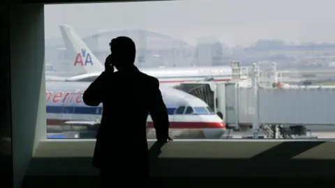 Getty Images a passenger in an airport terminal