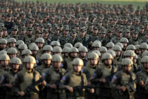 EPA Members of the military stand in formation as the government of El Salvador presented 14,000 military personnel as part of the Territorial Control Plan for public security, in Ciudad Arce, El Salvador, 23 November 2022.