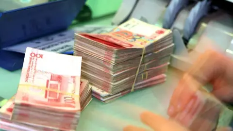 Getty Images China automated counting machine in bank