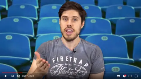 What Culture Adam Blampied presenting a video on YouTube