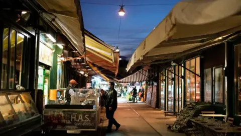 Getty Images Market stalls are pictured at the Naschmarkt in Vienna, 2 November 2020