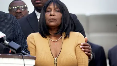 Getty Images RowVaughn Wells is comforted during a press conference