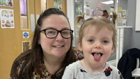 Laura and her daughter smiling