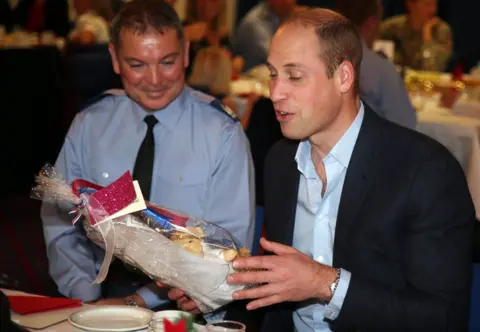 EPA Prince William joins families stationed at RAF Akrotiri base for a Christmas afternoon tea