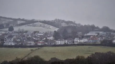 Jack Friday Snow begins to fall at Fforest in Carmarthenshire on Sunday