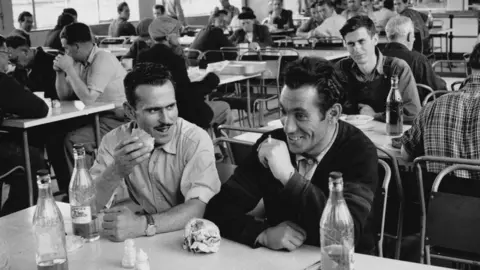 Getty Images Italian eating lunch in a brickworks canteen