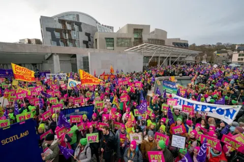 PA Media Teachers protest outside of the Scottish parliament