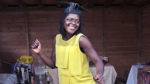 Glenn Edwards Tendai, from Zimbabwe, at her graduation party in Newport