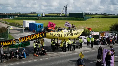 Getty Images Fracking activists block the entrance to the Cuadrilla's fracking site