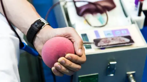 Getty Images The NHS is hoping to correct the gender imbalance in blood donation
